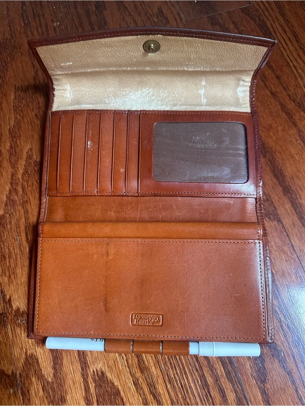 Dooney & Bourke Classic Pebbled Leather Wallet with Brown Trim